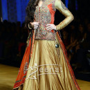 Nargis dazzled the runway in a golden lehenga at the India Bridal Fashion Week